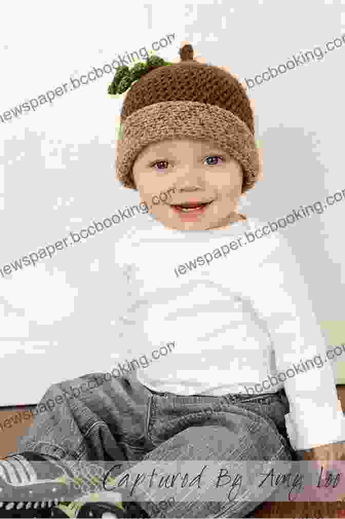 A Child Wearing An Acorn Shaped Knitted Hat And Holding A Matching Acorn Toy Acorn Child Knitting Pattern 6 Sizes Included