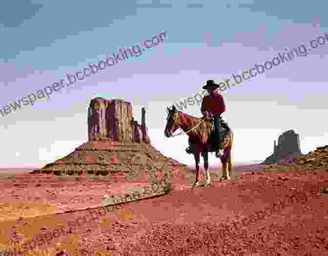 A Lone Navajo Man On Horseback Riding Through A Vast Desert Landscape. Ishi S Brain: In Search Of Americas Last Wild Indian
