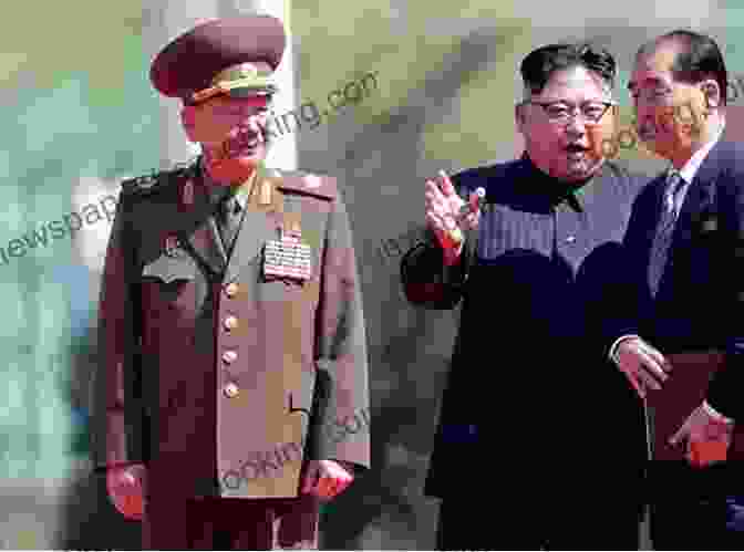 A Young Kim Jong Un In Military Uniform, Standing In Front Of A Large North Korean Flag. Becoming Kim Jong Un: A Former CIA Officer S Insights Into North Korea S Enigmatic Young Dictator